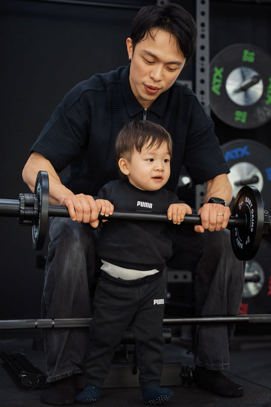Dad and son training in the home garage gym