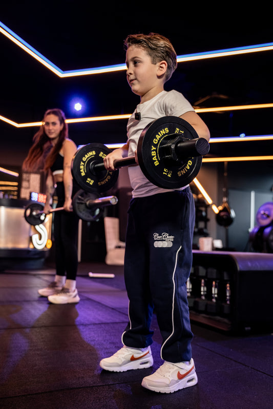 Kid mid-set inside a real gym's family play zone