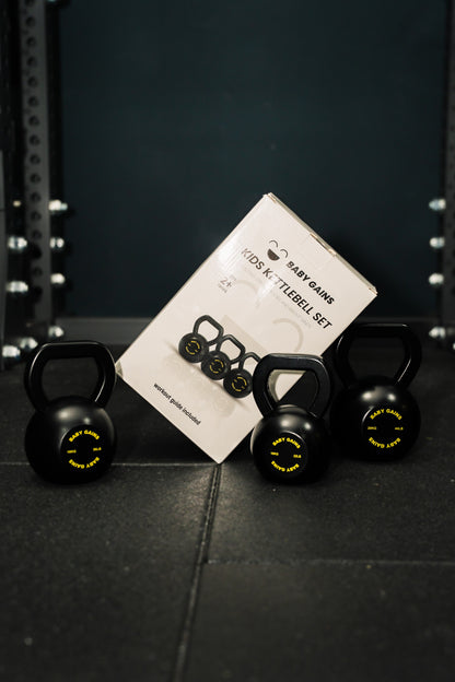 Baby Gains kids kettlebell set with box in a gym