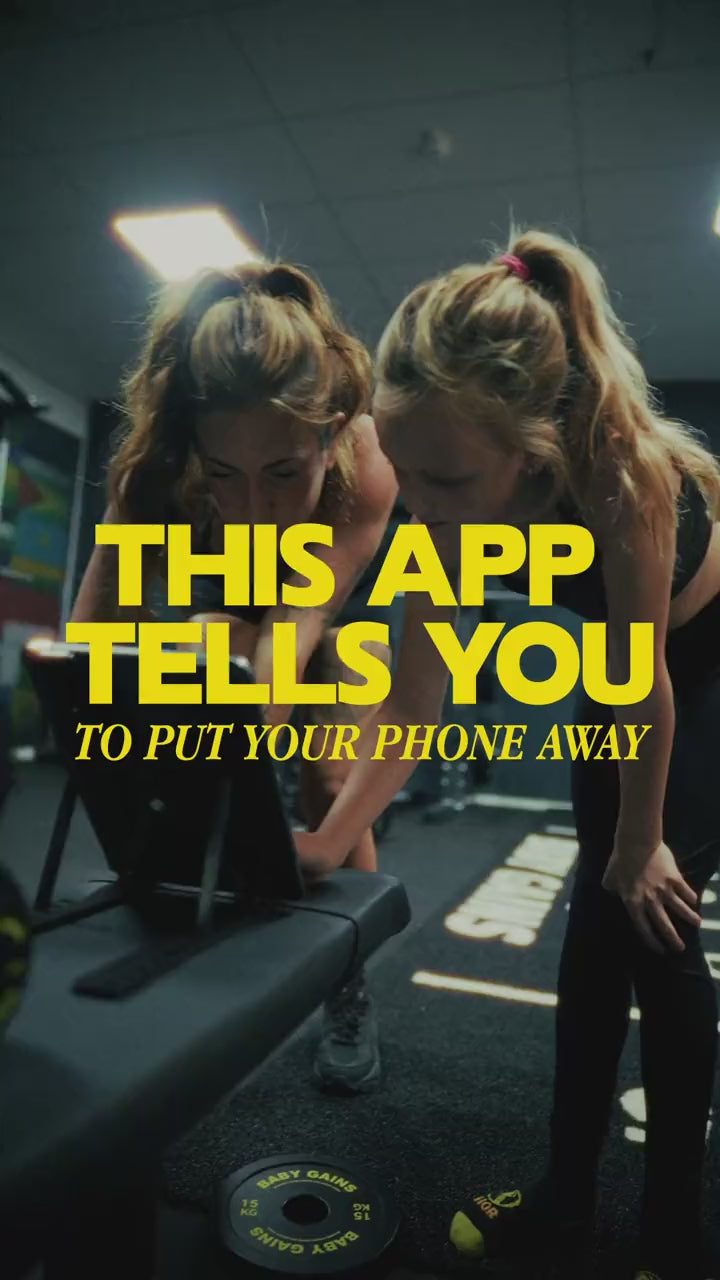 BabyGains Play promo: this app tells you to put your phone away. A parent and kid doing a real workout, guided by the app.